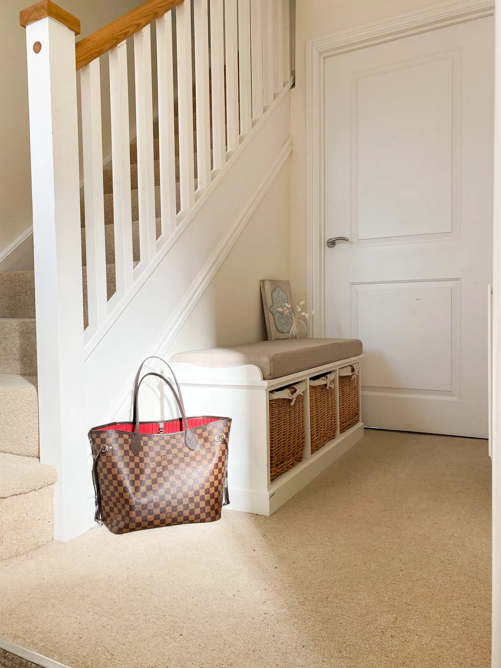 Mudroom Cabinets 5 Entry storage bench with baskets beside a staircase
