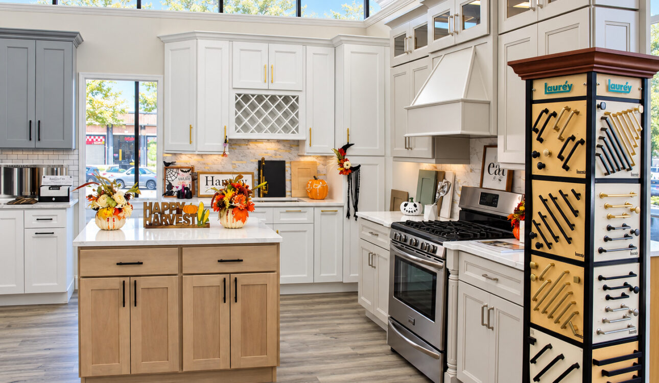 In-Stock vs. Custom Kitchen Cabinets: How to Choose for Your Newark, NJ Kitchen 1 White kitchen cabinets with a wood island on display at the Kitchen Factory Newark showroom in Newark, NJ