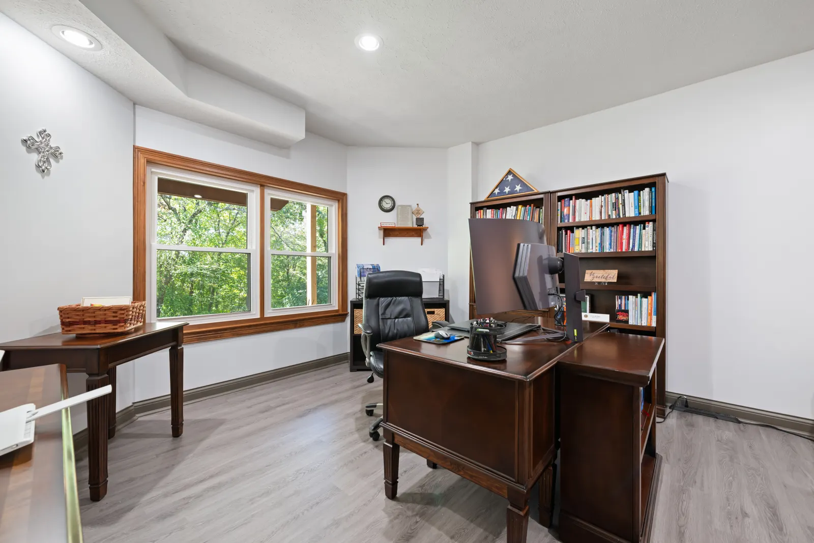 Home Office Cabinets 4 Home office with a wood desk, bookcase and storage cabinets