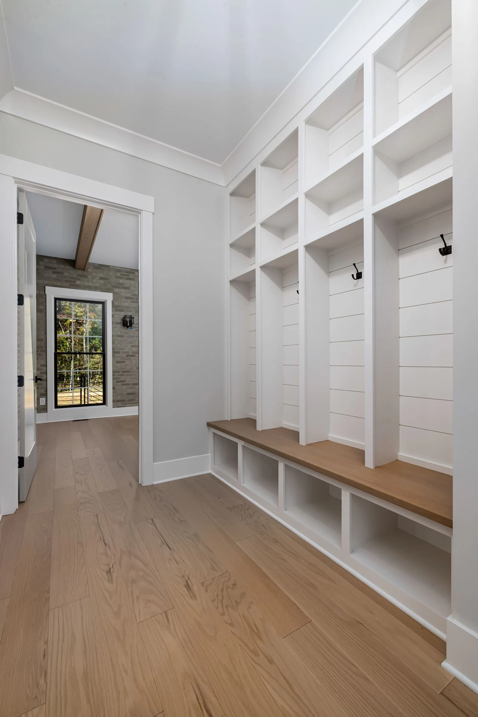 Mudroom Cabinets 2 White mudroom lockers with bench seat and cubbies by the entry door