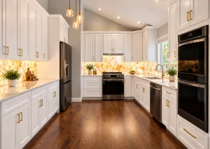 White shaker kitchen with a dark hardwood floor, wall ovens and a backlit backsplash